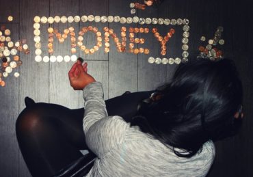 woman arranging coins